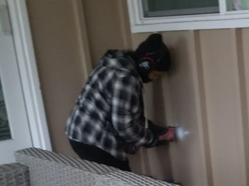 Professional electrician installing an exterior outlet in Lander