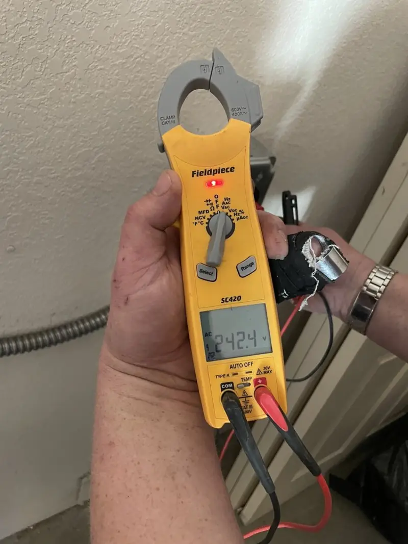 Voltage testing with clamp meter during Generator Installation in Lander